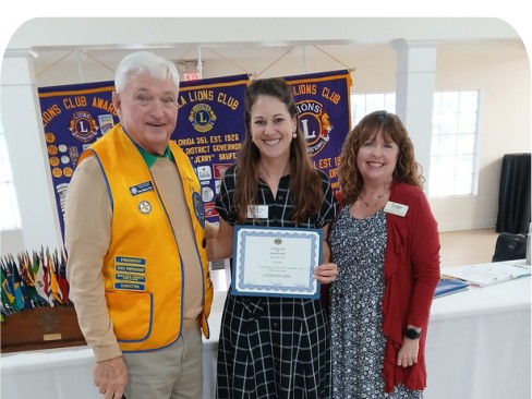 Ocala Lions at the June meeting, holding a certificate