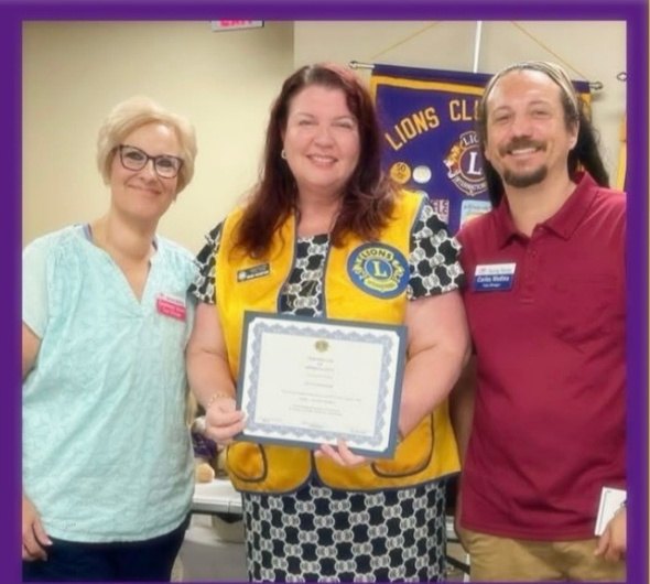 Ocala Lions presenting a certificate at the August Saving Mercy program
